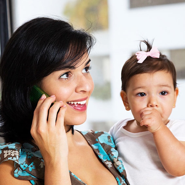 Woman on the Phone with a Baby